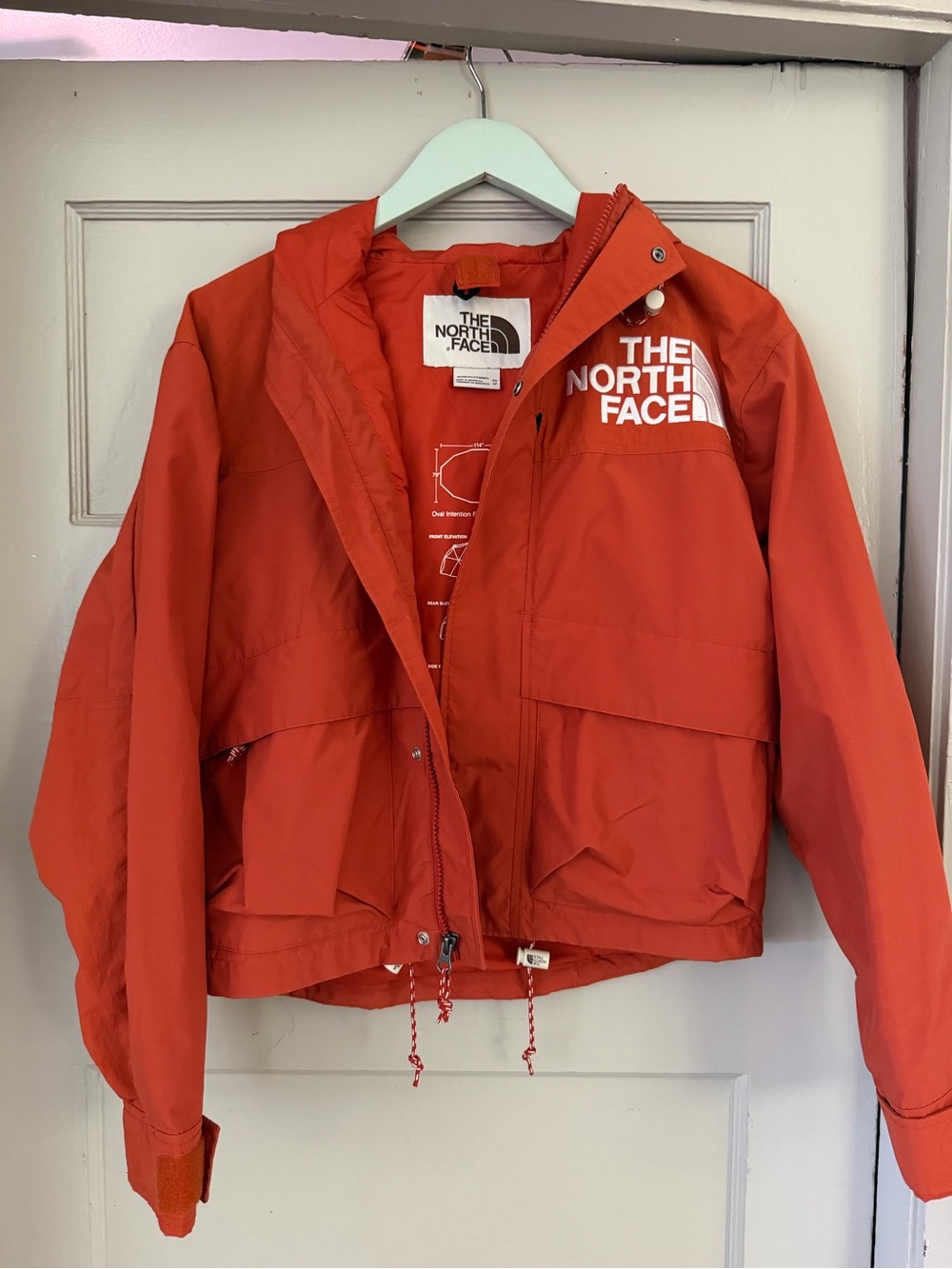 The North Face Retro women's shell Jacket in Orange.